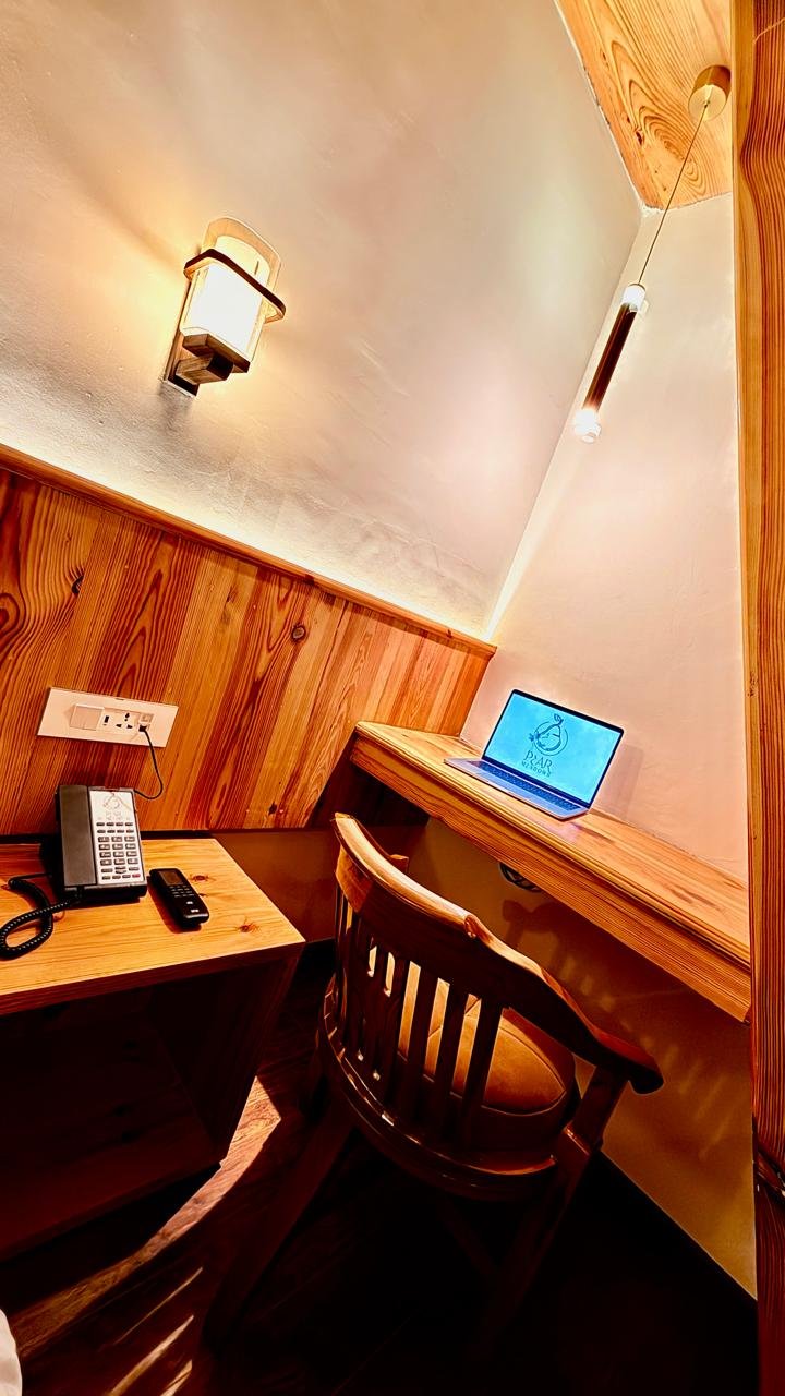 Comfortable bedding setup in Pear Meadows duplex room